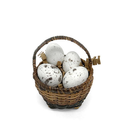basket of chocolate quail eggs - 4 white eggs
